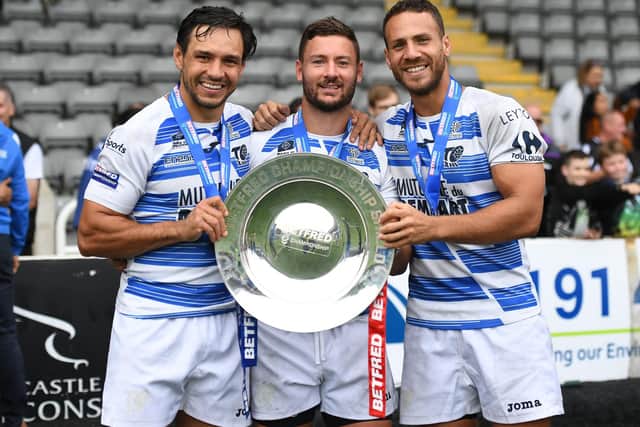 Toulouse Olympique's Mark Kheirallah, Jy Hitchcox and Lloyd White pose with the Betfred Championship League Leaders Shield. Picture: Will Palmer/SWpix.com.