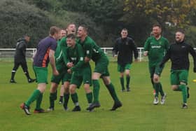 James King of Hunslet Club is mobbed after scoring the winning penalty in his side's 7-6 shootout victory over Beeston St Anthony's. PIcture: Steve Riding.