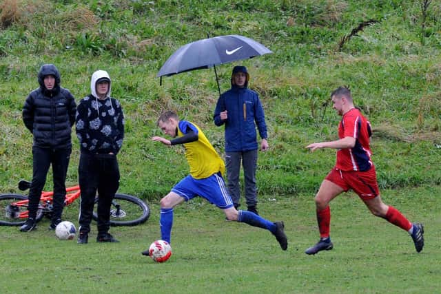 Tom Crowther goes down the wing for Stanningley Old Boys. Picture: Steve Riding.