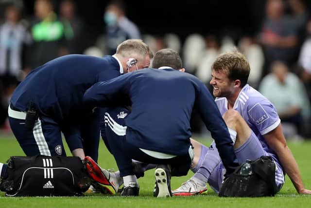 Leeds United striker Patrick Bamford receives treatment at Newcastle in September. Pic: Ian MacNicol/Getty Images