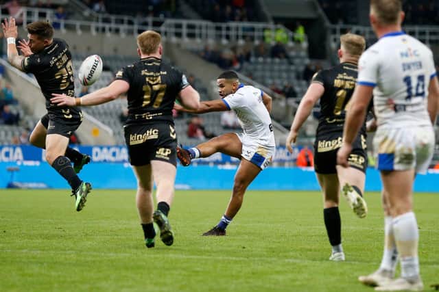 MAGIC MOMENT: Leeds Rhinos' Kruise Leeming scores a drop goal to beat Hull FC at the Dacia Magic Weekend Picture by Ed Sykes/SWpix.com