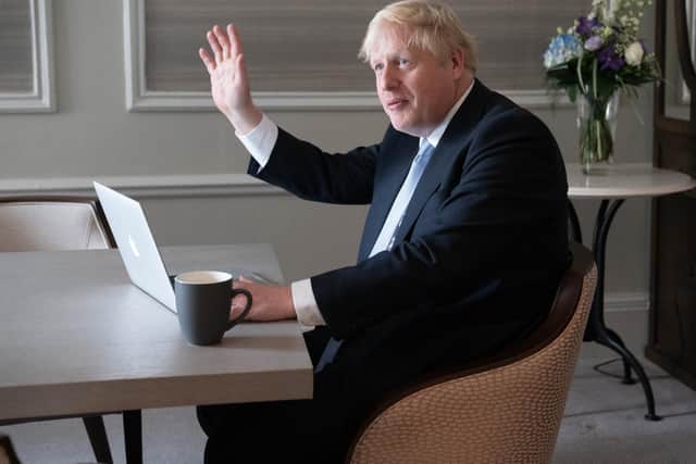 Prime Minister Boris Johnson prepares his keynote speech in his hotel room in Manchester before addressing the Conservative Party Conference on Wednesday (PA)