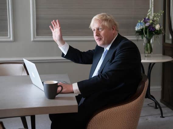 Prime Minister Boris Johnson prepares his keynote speech in his hotel room in Manchester before addressing the Conservative Party Conference on Wednesday (PA)