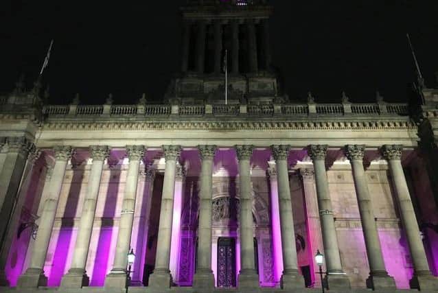Leeds Town Hall lit up in purple in support of the day in 2020
Pic: JPIMedia