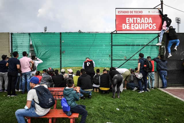 CLAMOUR: Fans try to get a peep of the Brazil squad training at their closed-door session at Techo stadium, in Bogota, Colombia on Tuesday ahead of the World Cup qualifier against Venezuela. Photo by JUAN BARRETO/AFP via Getty Images.
