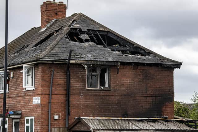 Three fighters must be on the scene of big fires before firefighters are allowed to enter. Picture: Tony Johnson.