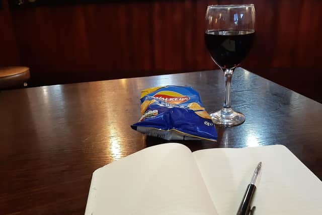 Red wine and a packet of crisps to help with the work flow.