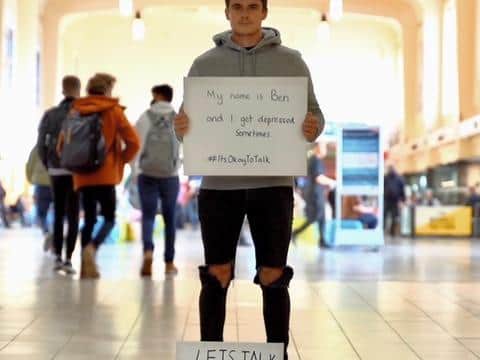 Ben Ogden, 23, stood in Leeds train station to encourage people to open up about their mental health.