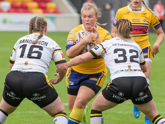 Beth Lockwood takes a hit-up for Rhinos against her old club York.