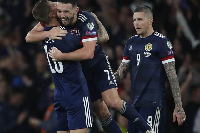 JOY: Leeds United captain Liam Cooper, left, celebrates with Aston Villa's John McGinn after Scotland's epic 3-2 success against Israel in Saturday's World Cup qualifier at Hampden Park. Photo by Ian MacNicol/Getty Images.