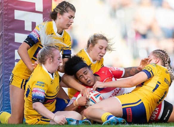 Rhinos' defence hold up Saints' Chantelle Crowl over the line. Picture by Allan McKenzie/SWpix.com.