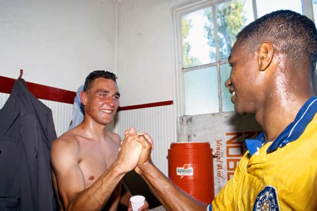 GOING UP: Vinnie Jones, left, and Chris Fairclough celebrate Leeds United's promotion as Division Two champions after the 1-0 victory at Bournemouth of May 1990. Photo by Ben Radford/Allsport/Getty Images.
