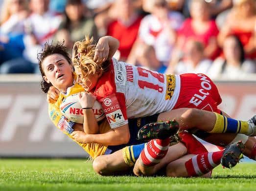 Rhinos' Hannah Butcher is tackled by Emily Rudge. Picture by Allan McKenzie/SWpix.com.