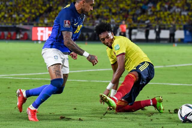 SKINNED: Leeds United winger Raphinha advances on another of his runs for Brazil in Sunday evening's goalless draw against Colombia in Barranquilla. Photo by JUAN BARRETO/AFP via Getty Images.