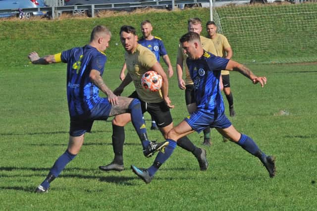 Jordan Walker, of Wykebeck Arms, splits the Kippax Sundays defence during Sunday's Sanford Cup encounter. Picture: Steve Riding.