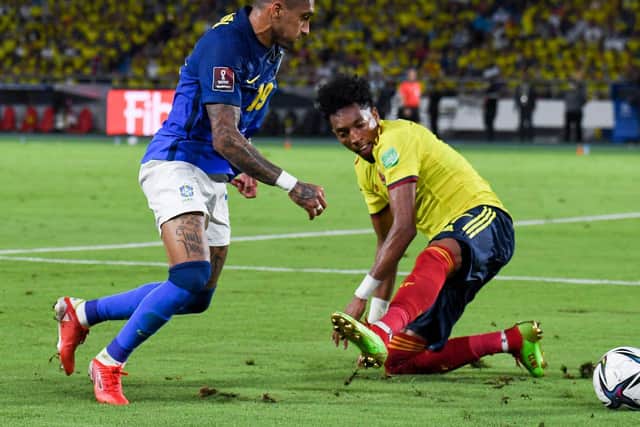 RECOGNITION: For Leeds United winger Raphinha, left, in action for Brazil during the goalless draw against Colombia in Barranquilla. Photo by JUAN BARRETO/AFP via Getty Images.