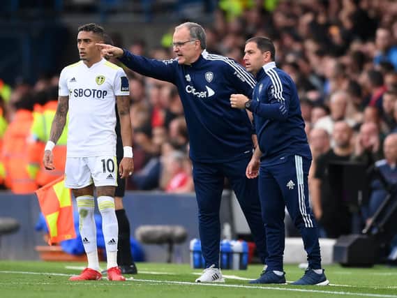 Leeds United boss Marcelo Bielsa gives instructions to Raphinha at Elland Road. Pic: Getty