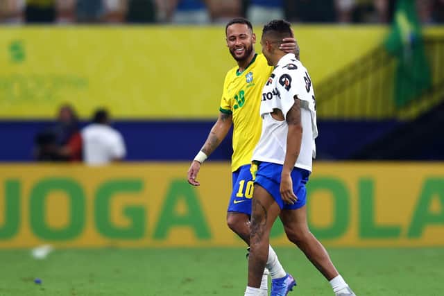 CHEMISTRY: Neymar, left, and Raphinha, right, following the 4-1 victory against Uruguay. Photo by Buda Mendes/Getty Images.