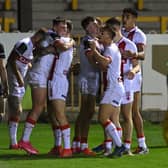 Leeds Rhinos' Jack Broadbent, second player from left, is congratulated after scoring for England Knights against Jamaica. Picture by Bruce Rollinson.