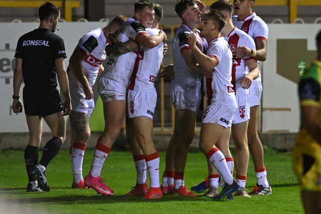 Leeds Rhinos' Jack Broadbent, second player from left, is congratulated after scoring for England Knights against Jamaica. Picture by Bruce Rollinson.