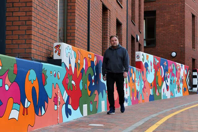 Nicolas Dixon working on a massive 130ft mural, which is one of the longest, if not the longest, single artworks in Leeds
PIC: Jonathan Gawthorpe