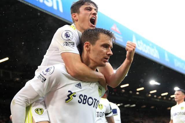 Dan James and Diego Llorente celebrate Leeds United's only goal against Watford. Pic: Alex Pantling.