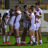Leeds Rhinos' Jack Broadbent celebrates scoring England Knights' first try in their 56-4 victory over 
Jamaica on Friday. Picture: Bruce Rollinson.