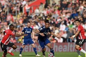 SOLE ATTEMPT: Tyler Roberts, centre, had Leeds United's only shot on goal in an awful first half for the Whites as part of an overall extremely disappointing display at Southampton. Photo by GLYN KIRK/AFP via Getty Images.