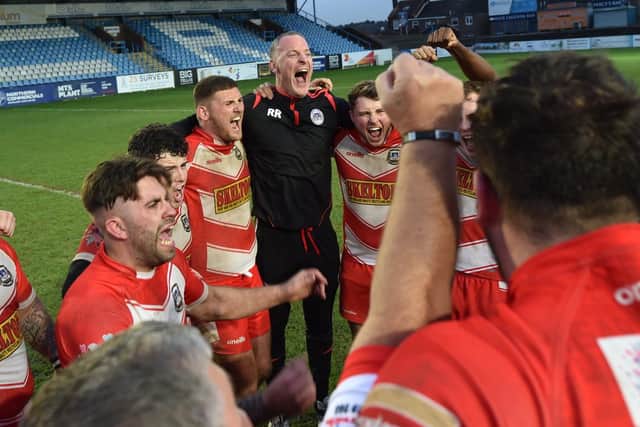 East Leeds coach Rob Roberts celebrates with his players at full time. Picture: Matthew Merrick.