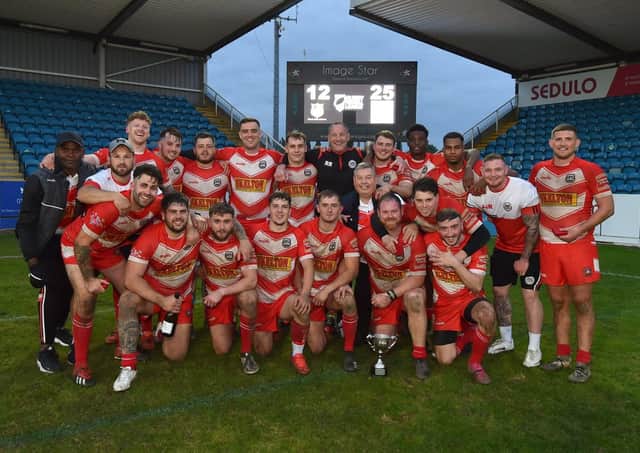 East Leeds celebrate their 25-12 victory over Clock Face Miners in the National Conference Cup final. Picture: Matthew Merrick.