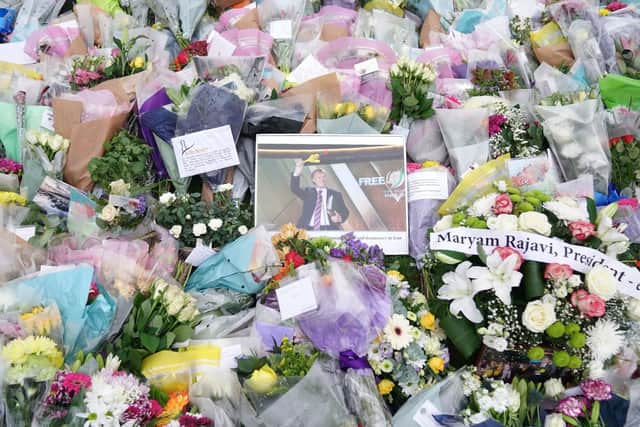 Flowers and tributes at the scene near Belfairs Methodist Church in Eastwood Road North, Leigh-on-Sea, Essex, where Conservative MP Sir David Amess died. PIC: PA