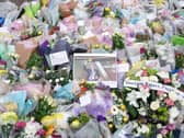 Flowers and tributes at the scene near Belfairs Methodist Church in Eastwood Road North, Leigh-on-Sea, Essex, where Conservative MP Sir David Amess died. PIC: PA
