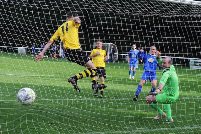 Headingley's Richard Booth scores the opener in his side's 5-0 West Yorkshire League Premier win over visiting Boroughbridge. Picture: Steve Riding.