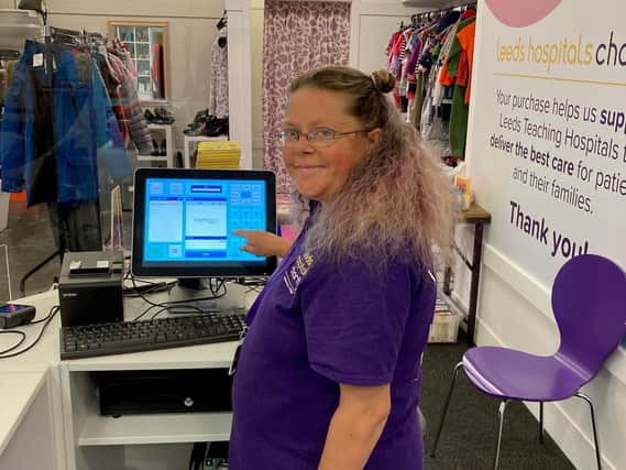 Janette Songhurst, 43, was one of the first volunteers to welcome new customers to the store during its opening week. 
PIC: Leeds Hospitals Charity