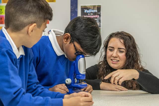 Science leader Mrs Sarah Burnill with year 6 pupils at Morley Newlands Primary School Academy which has converted a staff room into a full on science lab.