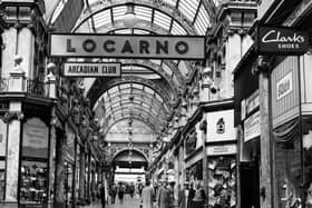 The County Arcade looking from the junction with Cross Arcade towards Briggate. On the left corner is Vickers gift shop selling silver, jewellery and watches. On the right, opposite, is a branch of Greenwoods menswear. Next right is the entrance to the Mecca Locarno Ballroom then Elster shoe shop.