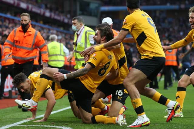 Ruben Neves of Wolverhampton Wanderers celebrates with teammate Conor Coady after scoring his side's winning goal at Aston Villa on Saturday. Picture: Alex Morton/Getty Images.