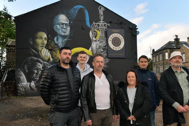 Members of the Supporters' Trust at the new mural's unveiling.