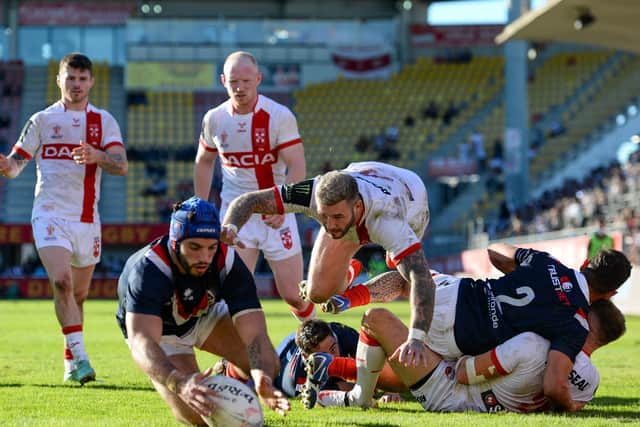 - 23/10/2021 - Rugby League - Men's International - France v England - Stade Gilbert Brutus, Perpignan, France - Zak Hardaker of England dives for the ball over Benjamin Jullien of France