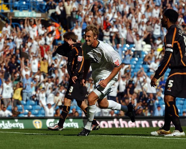 RUN OVER: Future England defender Joleon Lescott, right, looks on as Rob Hulse, centre, races away to celebrate putting Leeds United 2-0 up en route to victory against Wolves at Elland Road back in August 2005. Picture by Varleys.