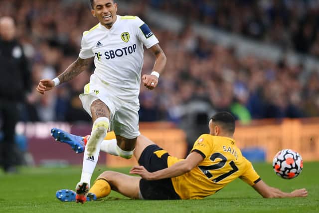 UPDATE: Issued by Leeds United's star Brazilian winger Raphinha, left, pictured being caught late by Romain Saiss in Saturday's 1-1 draw against Wolves at Elland Road. Photo by Stu Forster/Getty Images.