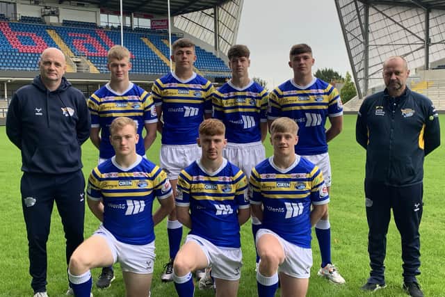 Leeds Rhinos head coach Richard Agar, left, along with head of academy recruitment and operations Simon Bell, far right, with the new Rhinos Academy recruits. From the back left are: Max Simpson, Jack Smith, Riley Lumb, Jack Johnson. Front from left: Will Gatus, Kai Morgan and Alfie Edgell. Picture: Leeds Rhinos.