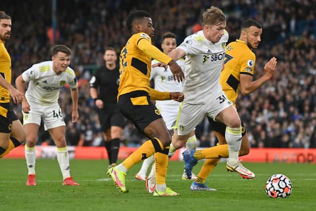 'BOLD AS BRASS': Leeds United's 19-year-old forward Joe Gelhardt storms into the Wolves box to win a dramatic late penalty as Jamie Shackleton, left, looks on. Picture by Bruce Rollinson.