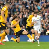 SURROUNDED: Leeds United's Dan James looks to press on as Ruben Neves leads the Wolves bid to thwart his advances. Picture by Bruce Rollinson.