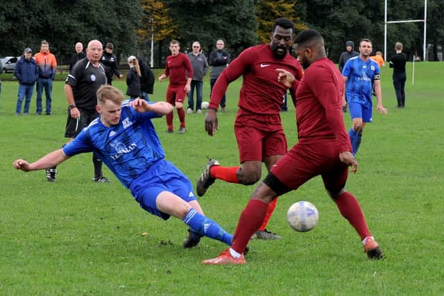 Joe Hill of HT Sports wins the ball against Little London in the Sanford Cup. Picture: Steve Riding.