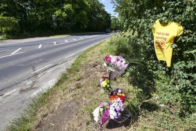 Floral tributes on Castle Syke Hill following the fatal crash in 2019.