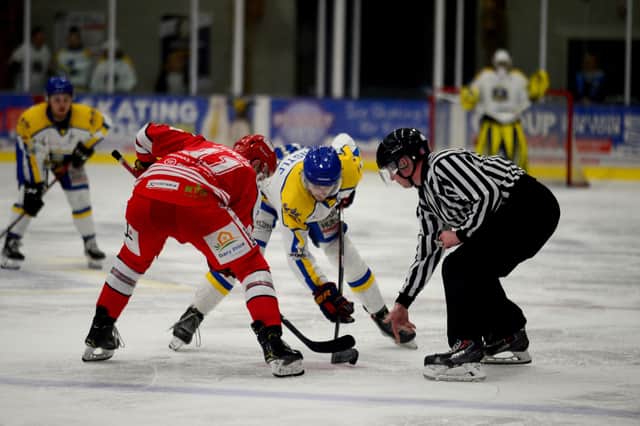 FACE TIME: Brandon Whistle faces off against Swindon Wildcats' Chris Jones during Sunday night's NIHL National clash at Elland Road Ice Arena. Picture James Hardisty.