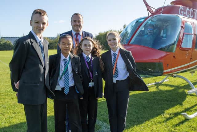 Coun Ryan Stephenson, a governor at John Smeaton, ready to take off with students in the organised helicopter ride.