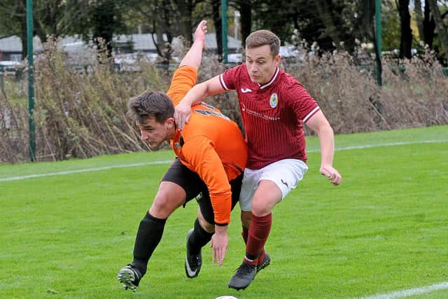 Alex Bell, left, of Leeds Medics and Dentists 3rds challenges Jack Monk of Gildersome Spurs Reserves. Picture: Steve Riding.