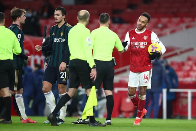 Arsenal's Pierre-Emerick Aubameyang claims the match ball after putting three past Leeds United at the Emirates stadium. Pic: Julian Finney.